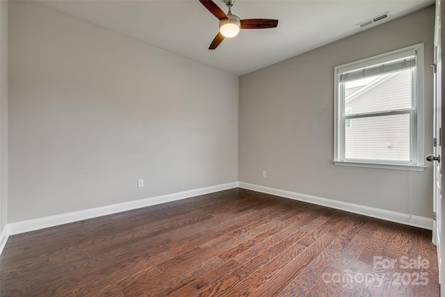 4926 Trayton Ave, Gastonia, NC 28056 - empty room with a ceiling fan, baseboards, visible vents, and dark wood-style floors
