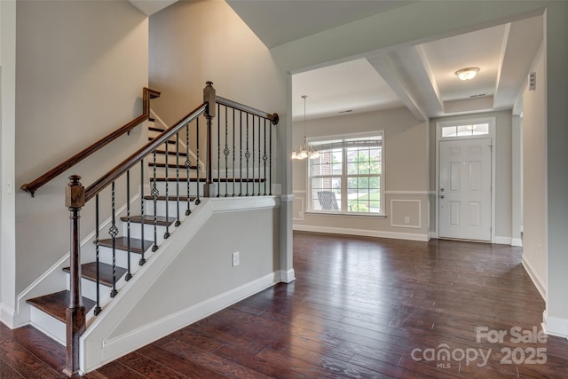 4926 Trayton Ave, Gastonia, NC 28056 - staircase featuring baseboards, an inviting chandelier, and hardwood / wood-style flooring