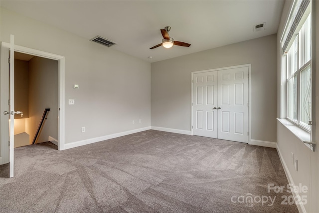 4926 Trayton Ave, Gastonia, NC 28056 - unfurnished bedroom with visible vents, baseboards, carpet floors, and a closet