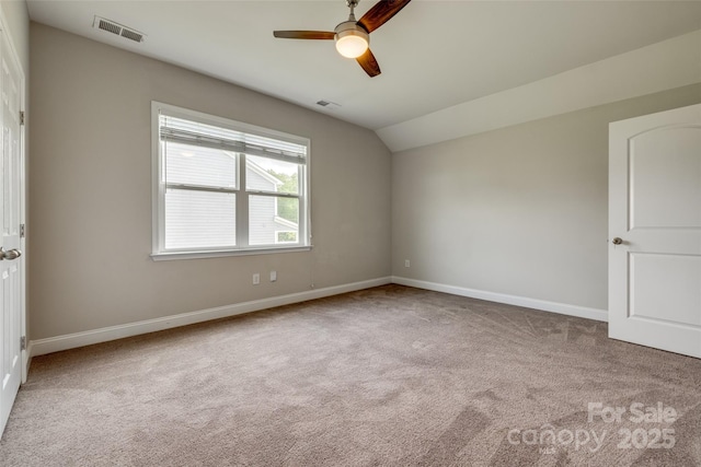4926 Trayton Ave, Gastonia, NC 28056 - carpeted empty room with visible vents, baseboards, ceiling fan, and vaulted ceiling