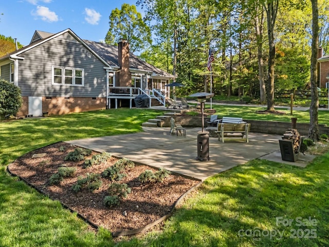 exterior space featuring a patio, a chimney, a deck, and crawl space