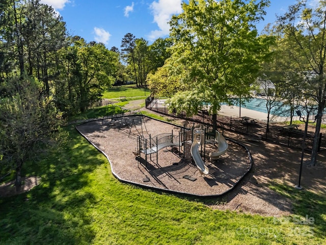view of yard with fence and playground community
