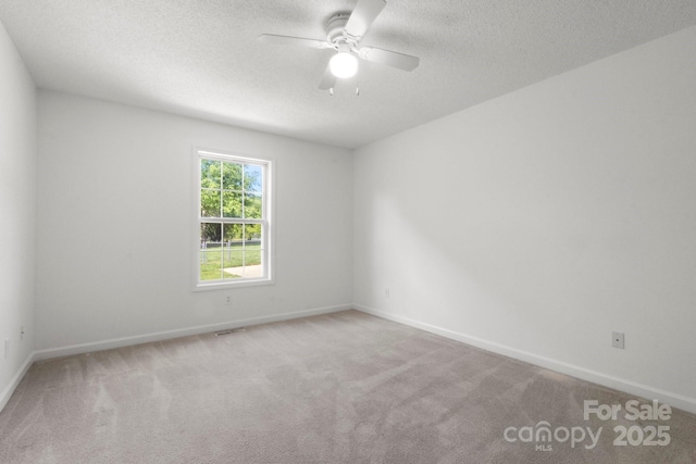 318 Huffman Rd, Gastonia, NC 28056 - unfurnished room featuring carpet floors, ceiling fan, a textured ceiling, and baseboards