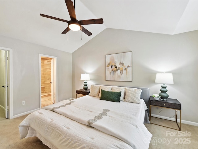bedroom with vaulted ceiling, carpet, baseboards, ceiling fan, and ensuite bathroom