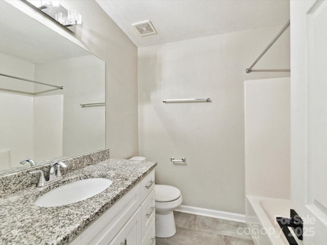 bathroom featuring toilet, baseboards, vanity, tile patterned floors, and shower / tub combination