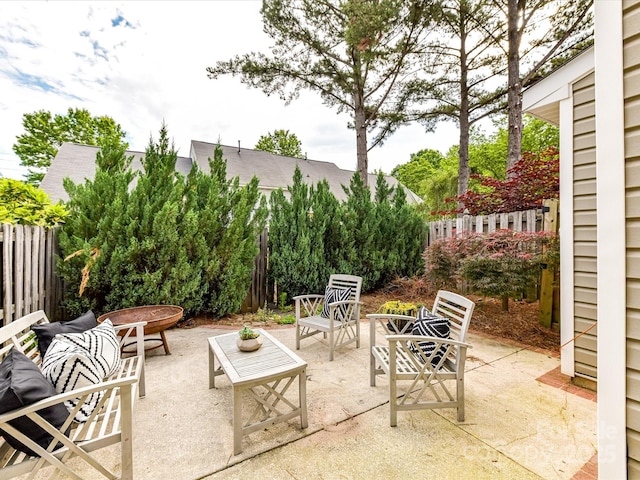 view of patio / terrace featuring fence