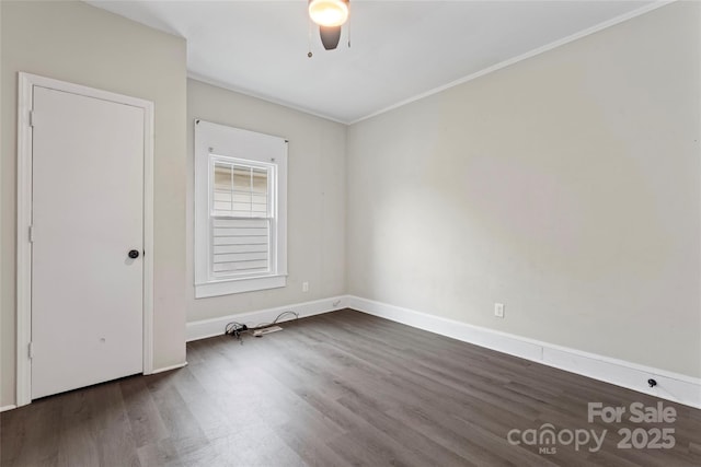 unfurnished room with wood finished floors, ceiling fan, ornamental molding, and baseboards