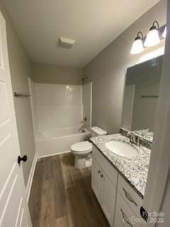 4172 Saltwood Dr, Hickory, NC 28602 - full bath featuring wood finished floors, toilet, vanity, and  shower combination