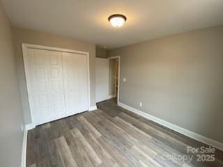 4172 Saltwood Dr, Hickory, NC 28602 - unfurnished bedroom featuring wood finished floors, a closet, and baseboards
