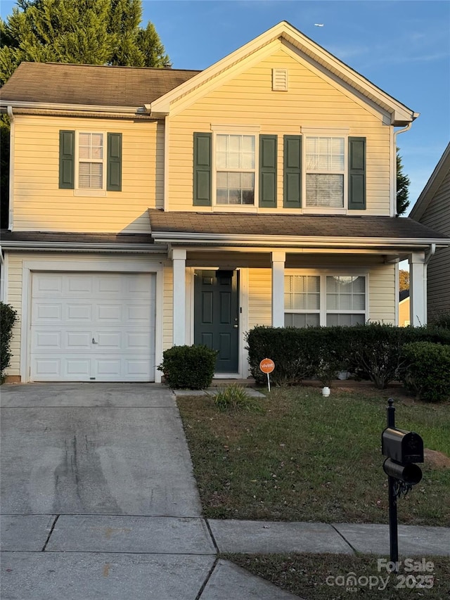 1012 Kings Mountain Ln, Gastonia, NC 28054 - view of front of property with a garage, a front lawn, driveway, and covered porch