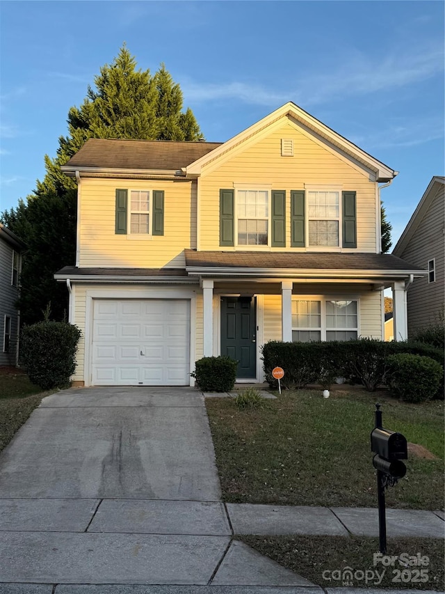 1012 Kings Mountain Ln, Gastonia, NC 28054 - traditional-style house with a garage, driveway, a porch, and a front yard