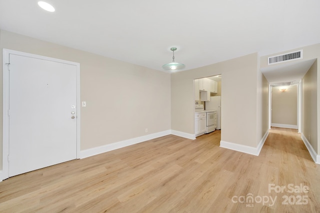 1323 Queens Rd Unit 420, Charlotte, NC 28207 - interior space featuring light wood finished floors, visible vents, and baseboards