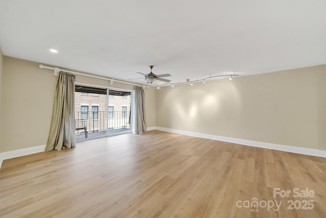 1323 Queens Rd Unit 420, Charlotte, NC 28207 - spare room featuring baseboards, a ceiling fan, and light wood finished floors