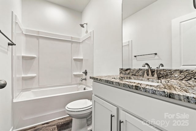 3567 Farmfield Dr, Claremont, NC 28610 - full bath with bathing tub / shower combination, vanity, toilet, and wood finished floors