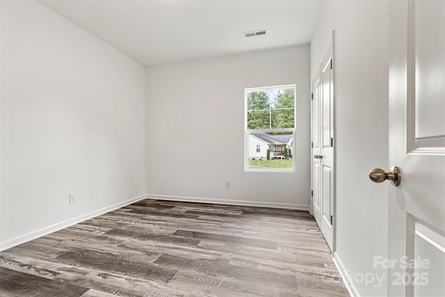 3567 Farmfield Dr, Claremont, NC 28610 - spare room with visible vents, baseboards, and wood finished floors
