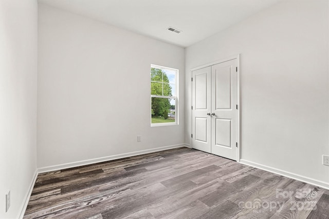 3567 Farmfield Dr, Claremont, NC 28610 - empty room featuring visible vents, baseboards, and wood finished floors