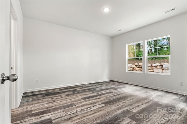 3567 Farmfield Dr, Claremont, NC 28610 - unfurnished room with baseboards, visible vents, and wood finished floors
