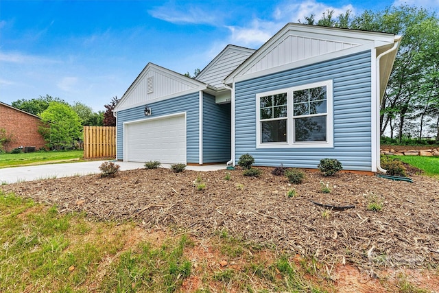 3567 Farmfield Dr, Claremont, NC 28610 - ranch-style home with board and batten siding, an attached garage, and driveway