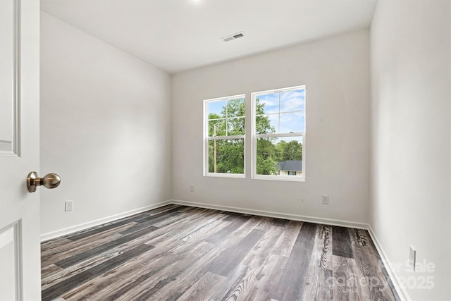 3567 Farmfield Dr, Claremont, NC 28610 - empty room featuring baseboards, dark wood-style flooring, and visible vents