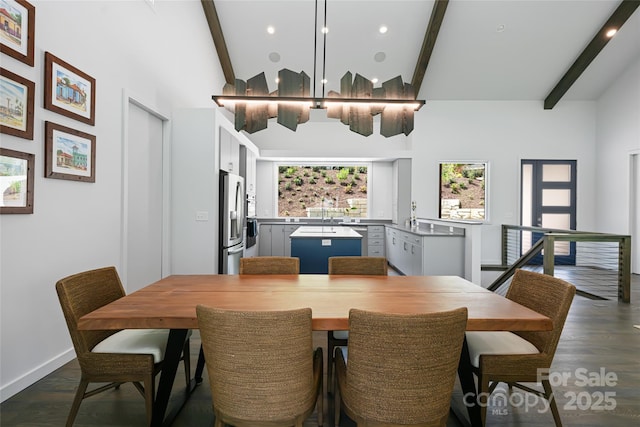 dining room featuring baseboards, beam ceiling, and dark wood-type flooring