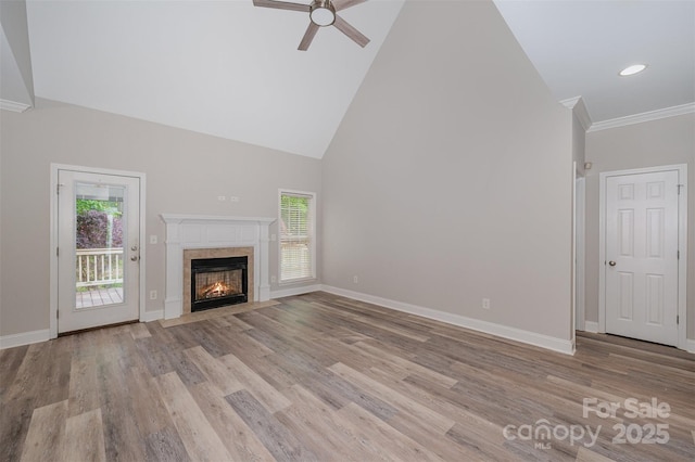 1033 Marguerite Dr, Lowell, NC 28098 - unfurnished living room featuring a healthy amount of sunlight, high vaulted ceiling, a ceiling fan, and light wood-type flooring