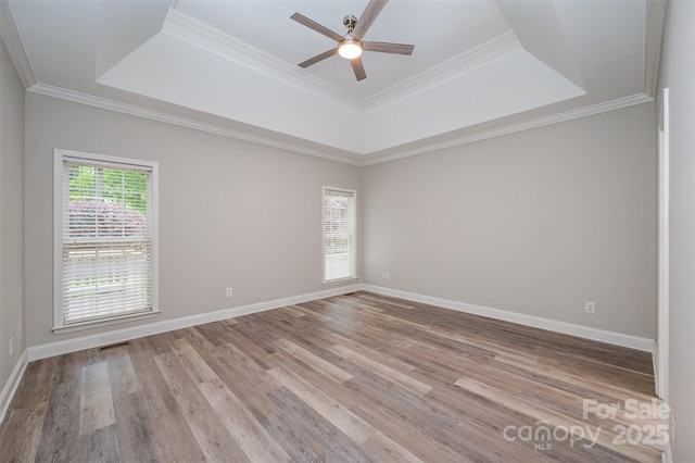 1033 Marguerite Dr, Lowell, NC 28098 - spare room with a ceiling fan, a tray ceiling, visible vents, and light wood-type flooring