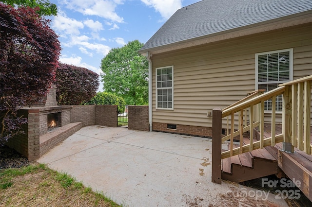 1033 Marguerite Dr, Lowell, NC 28098 - view of patio featuring an outdoor brick fireplace