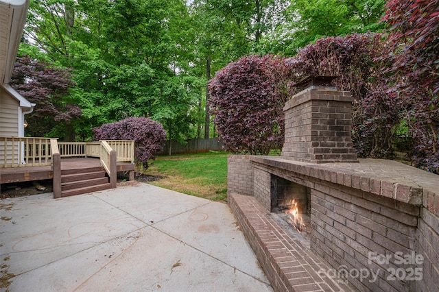 1033 Marguerite Dr, Lowell, NC 28098 - view of patio featuring fence, a wooden deck, and an outdoor brick fireplace
