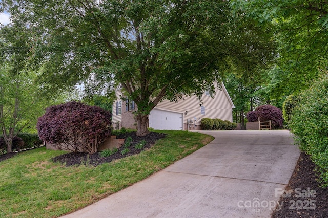 1033 Marguerite Dr, Lowell, NC 28098 - view of property exterior with concrete driveway and a yard