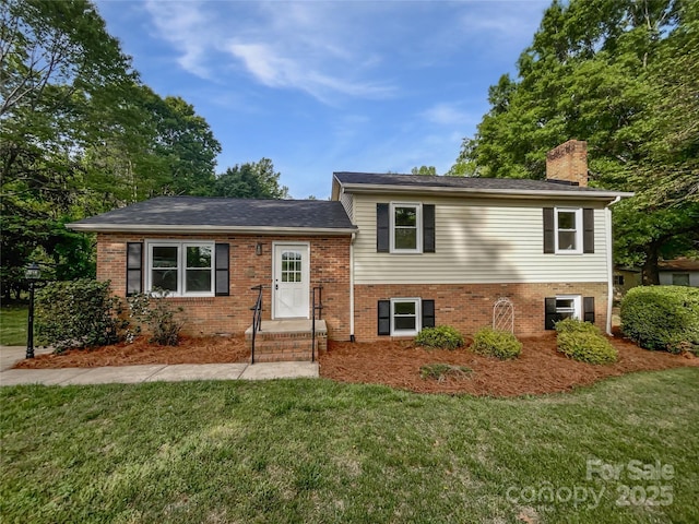 269 Bud Black Rd, Crouse, NC 28033 - split level home featuring a chimney, brick siding, and a front yard