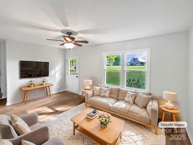 269 Bud Black Rd, Crouse, NC 28033 - living area featuring baseboards, a ceiling fan, and wood finished floors
