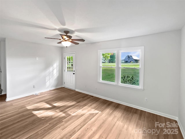 269 Bud Black Rd, Crouse, NC 28033 - unfurnished room with baseboards, a ceiling fan, visible vents, and light wood finished floors