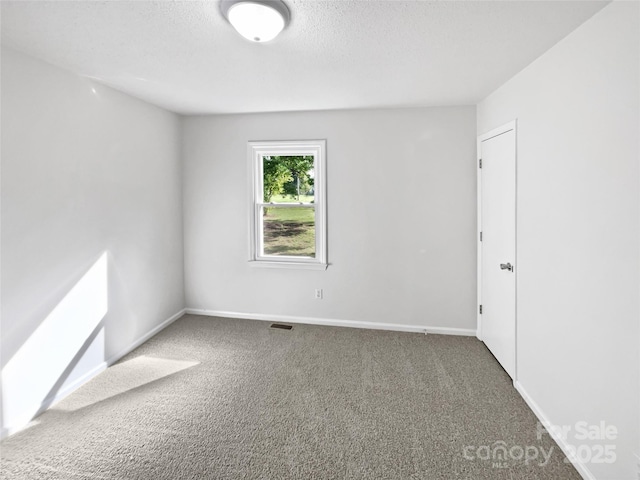 269 Bud Black Rd, Crouse, NC 28033 - carpeted empty room featuring a textured ceiling, visible vents, and baseboards