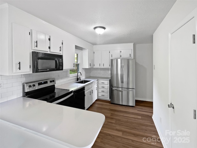 269 Bud Black Rd, Crouse, NC 28033 - kitchen featuring a sink, black appliances, decorative backsplash, white cabinets, and dark wood-style flooring