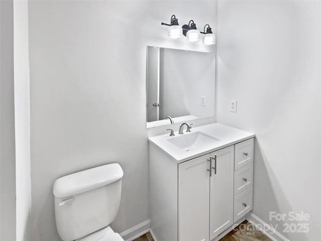 269 Bud Black Rd, Crouse, NC 28033 - half bathroom with toilet, vanity, and baseboards