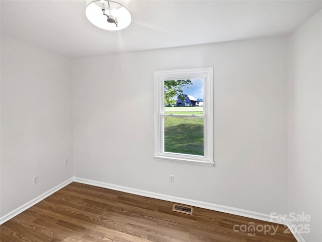 269 Bud Black Rd, Crouse, NC 28033 - empty room featuring baseboards, visible vents, and dark wood finished floors