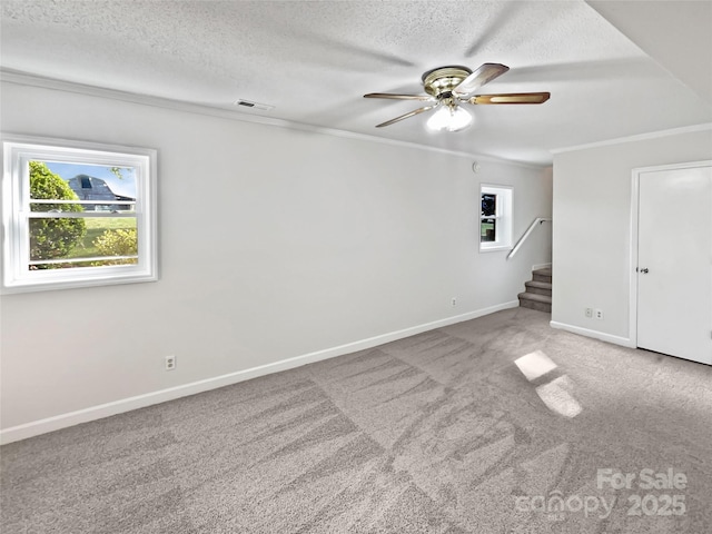 269 Bud Black Rd, Crouse, NC 28033 - empty room featuring a ceiling fan, a textured ceiling, carpet floors, ornamental molding, and visible vents