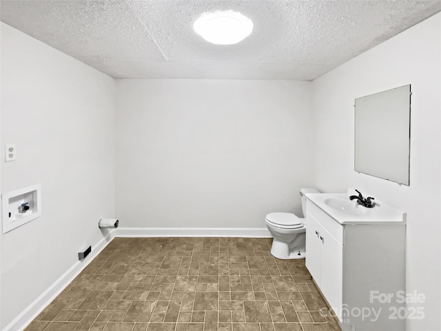 269 Bud Black Rd, Crouse, NC 28033 - half bath featuring toilet, vanity, a textured ceiling, and baseboards
