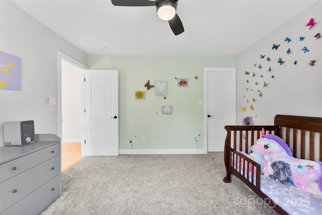 bedroom featuring baseboards, ceiling fan, and light colored carpet