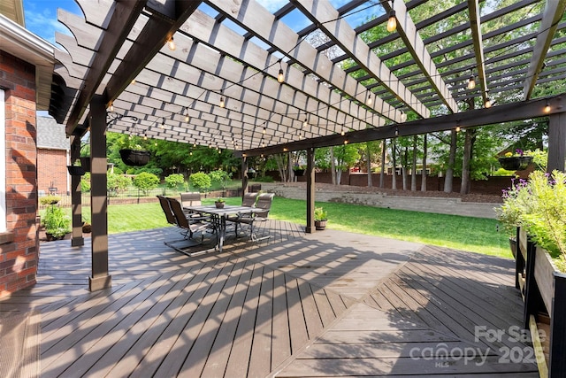 wooden terrace with fence, outdoor dining space, a yard, and a pergola