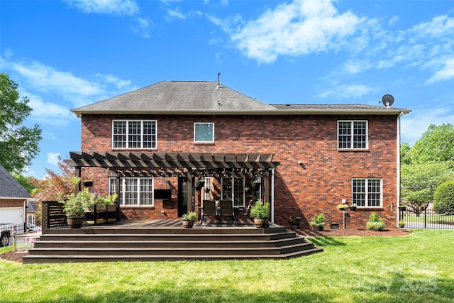 back of property featuring a wooden deck, a pergola, a lawn, fence, and brick siding