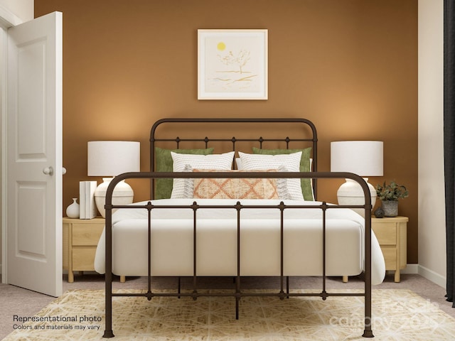 carpeted bedroom featuring baseboards