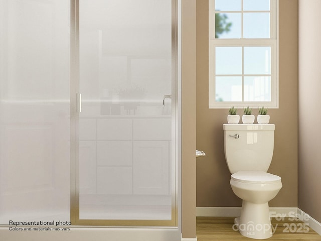 full bath with toilet, baseboards, and a shower