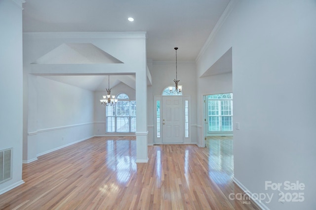 3226 Chatfield Ln SW, Concord, NC 28027 - foyer entrance featuring baseboards, a wealth of natural light, and a notable chandelier