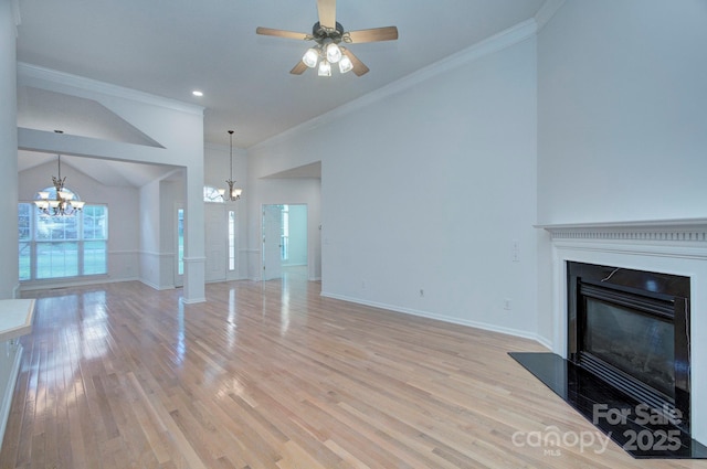 3226 Chatfield Ln SW, Concord, NC 28027 - unfurnished living room with light wood-type flooring, baseboards, a glass covered fireplace, and ornamental molding