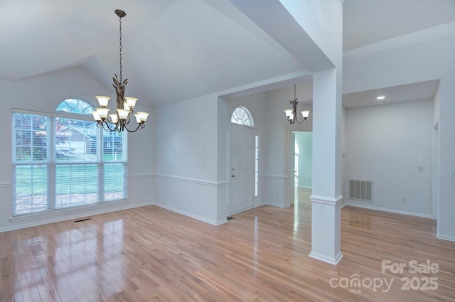 3226 Chatfield Ln SW, Concord, NC 28027 - unfurnished dining area featuring baseboards, a notable chandelier, visible vents, and light wood-style flooring