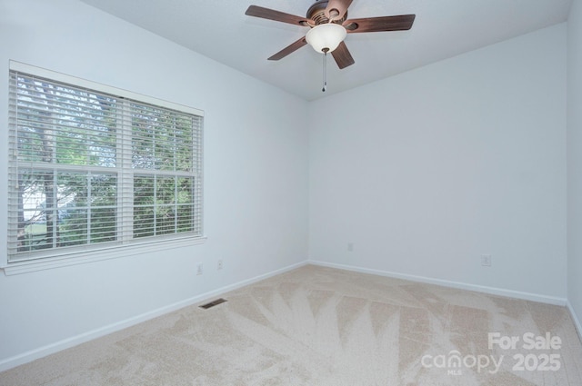 3226 Chatfield Ln SW, Concord, NC 28027 - spare room featuring visible vents, a ceiling fan, baseboards, and light carpet