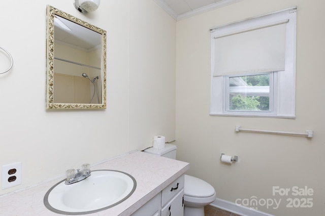 full bathroom featuring baseboards, toilet, vanity, and ornamental molding
