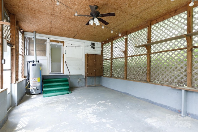 exterior space featuring entry steps, gas water heater, and ceiling fan