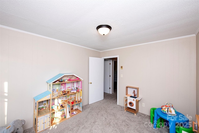 game room featuring carpet floors, a textured ceiling, and crown molding